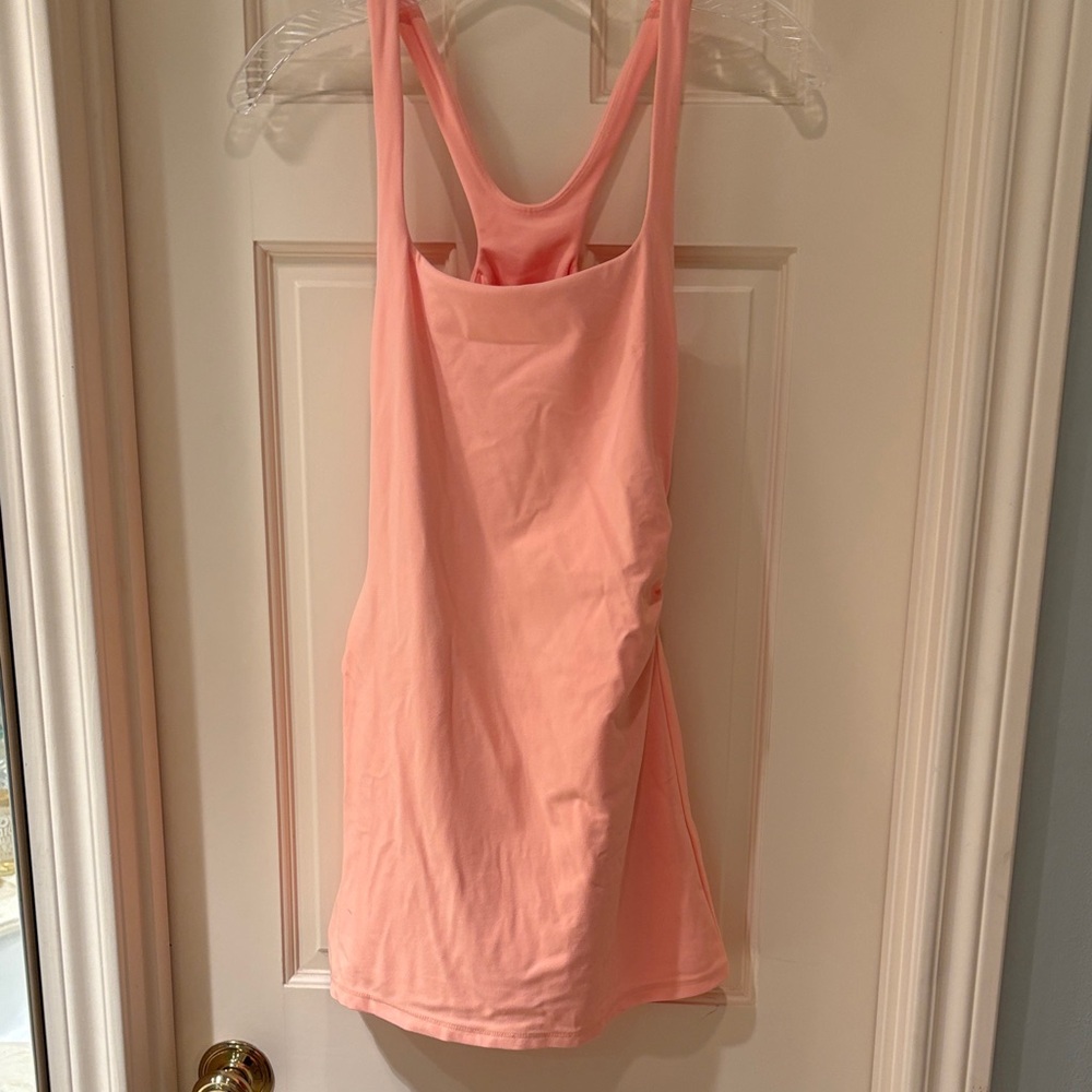 Women's orange FP movement workout dress.